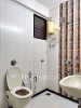 Washroom of Govind Paradise TrustedStay Service Apartment in Kopar Khairane, Navi Mumbai